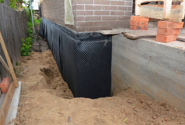 SJ Waterproofing Pros technician performing targeted Basement Waterproofing assessment in Alma, GA